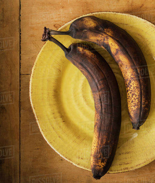 Still life with rotting bananas Stock Photo Dissolve