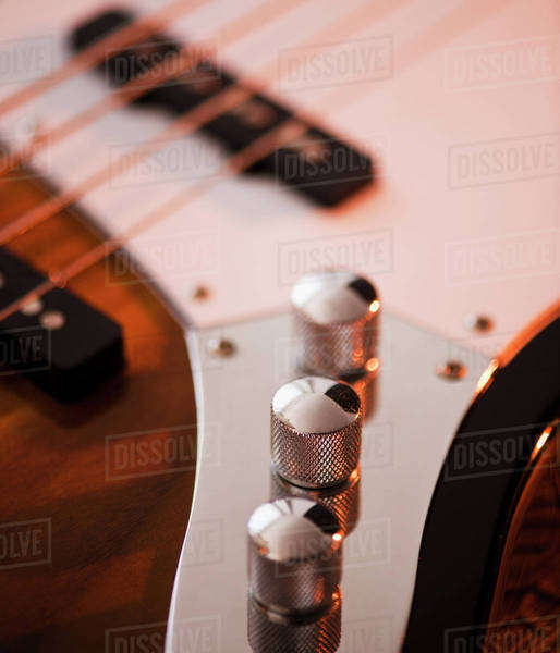 Close up of volume knobs of bass guitar Stock Photo Dissolve