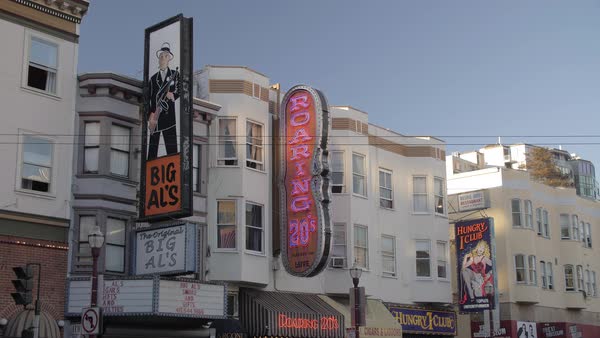Busy Columbus Avenue And Clubs Signs On Buildings In North Beach