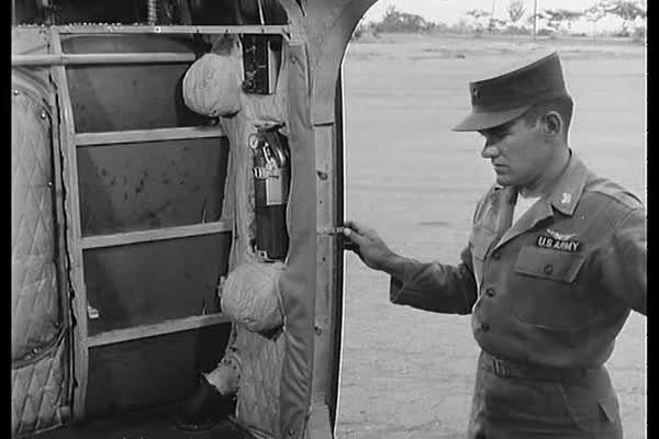 A Pilot Checks The Cabin On The H 19 Helicopter In Pre Flight