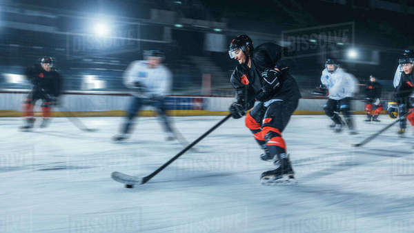 Ice Hockey Rink Arena: Professional Forward Player Breaks Defense ...