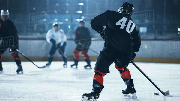 Ice Hockey Rink Arena: Professional Forward Player Breaks Defense ...