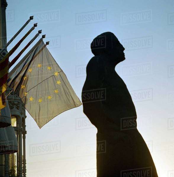 Statue with European Union flag Stock Photo Dissolve