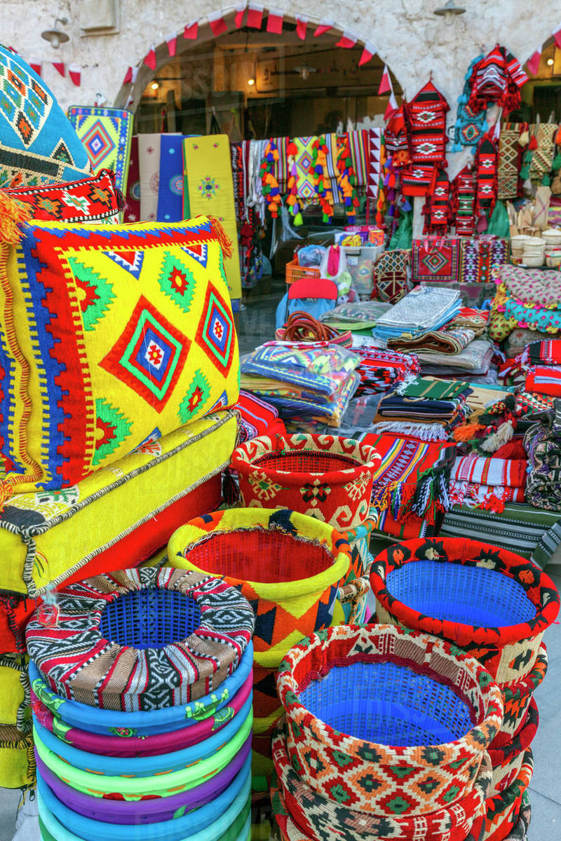 Bright textiles in market in Doha, Qatar Stock Photo Dissolve