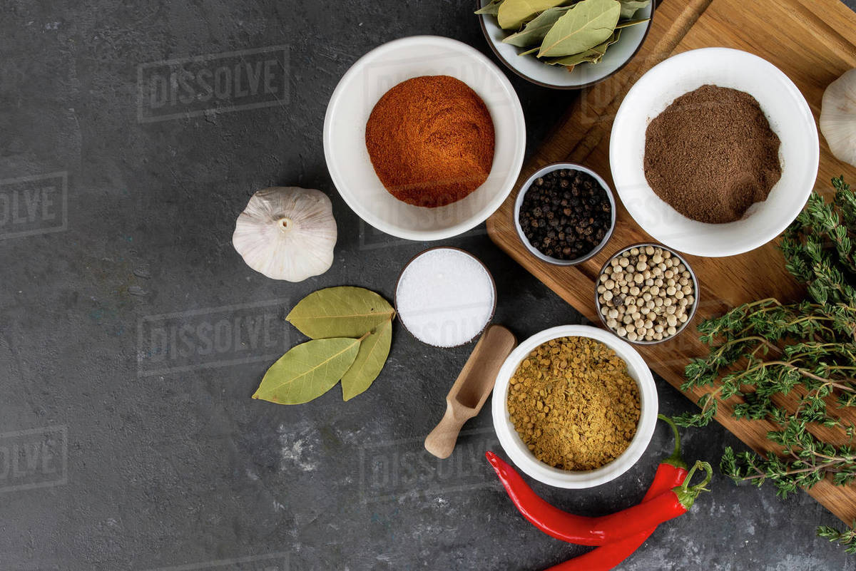 Herbs and spices with chili peppers Stock Photo Dissolve