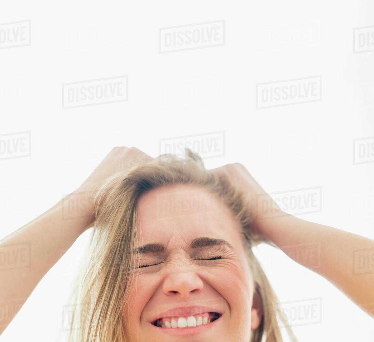 Frustrated woman pulling hair Stock Photo Dissolve