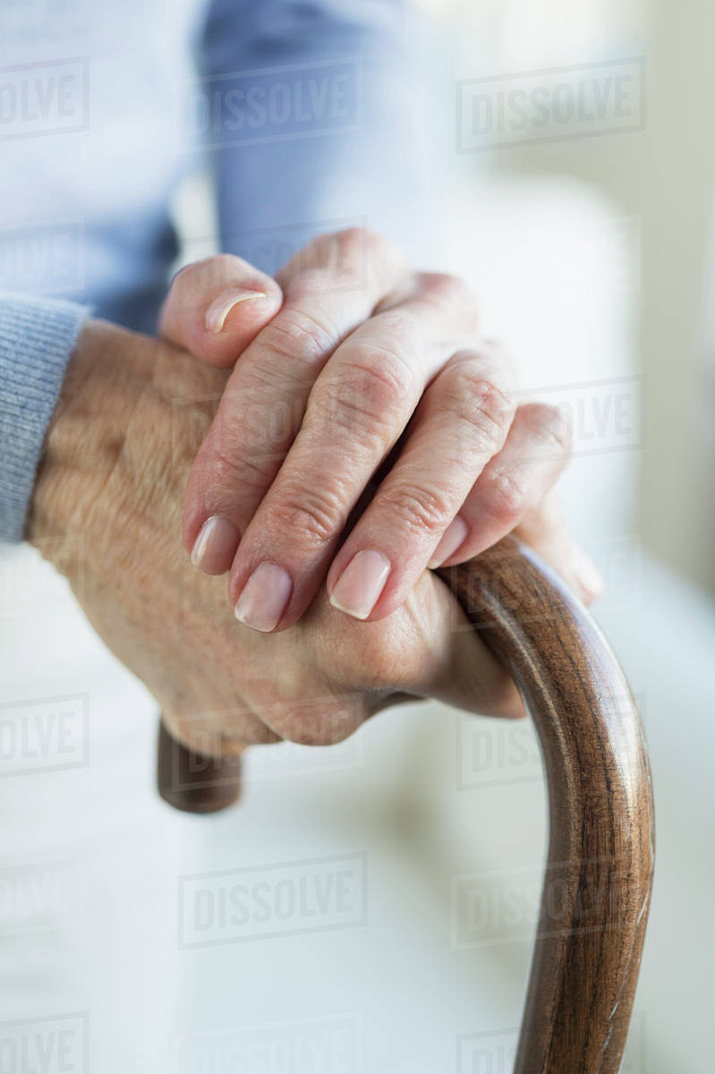 Close-up of hands of grandmother and granddaughter (16-17) Royalty-free stock photo