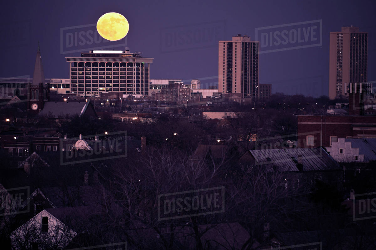 USA, Illinois, Chicago skyline with full moon Stock Photo Dissolve