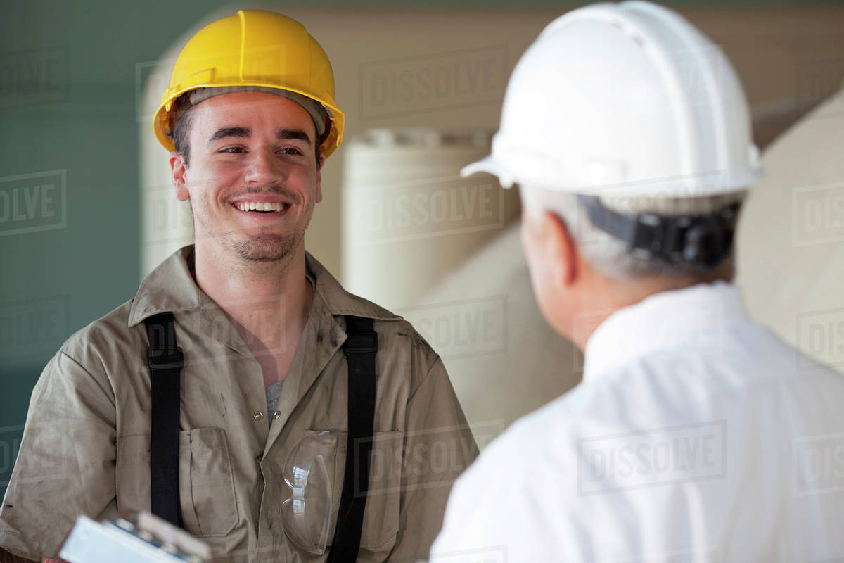 Manual worker and manager Stock Photo Dissolve