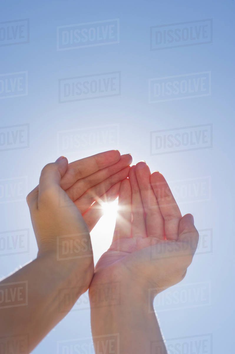 Hands framing sunshine Stock Photo Dissolve