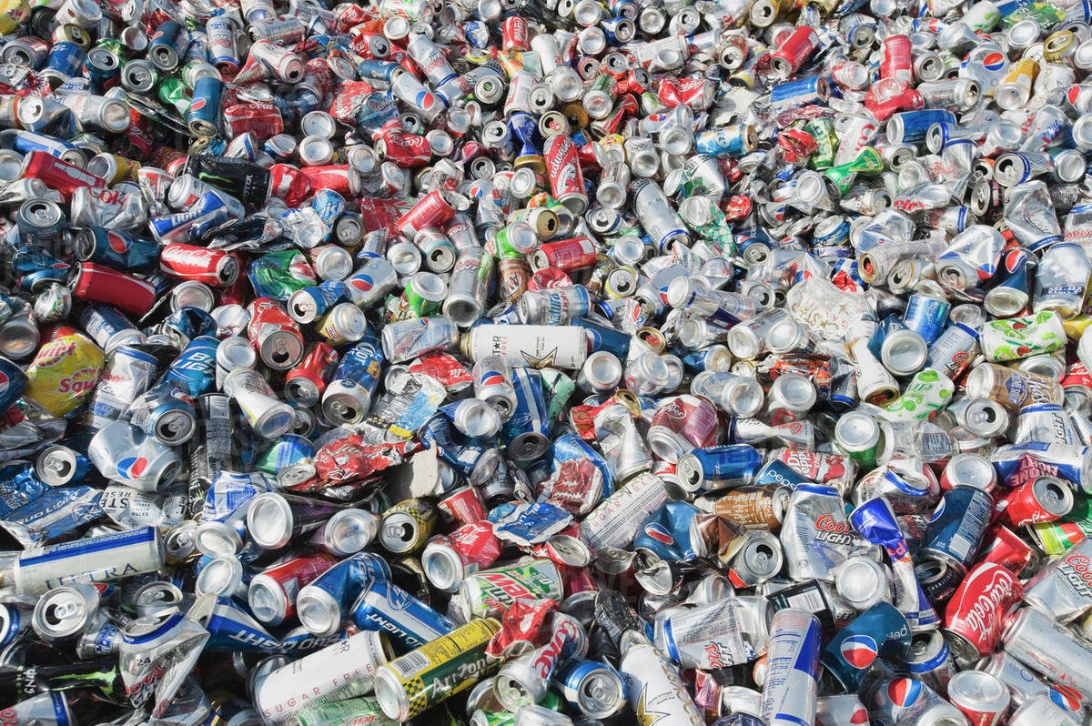 Pile of aluminum cans at recycling plant Stock Photo Dissolve