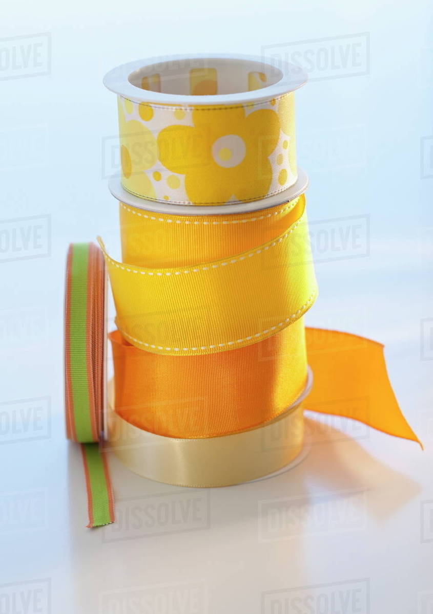 Studio shot of yellow ribbons Stock Photo Dissolve
