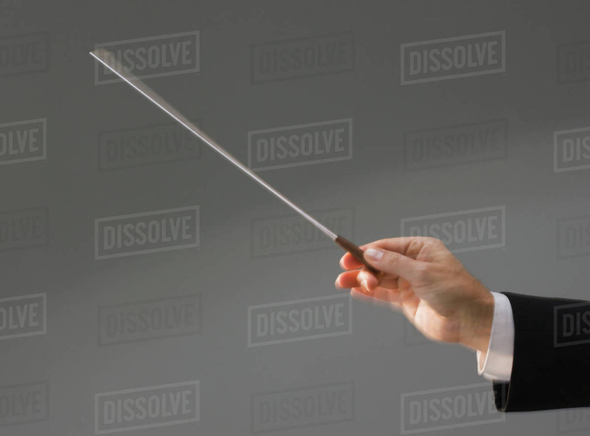 Male conductor’s hand holding baton Stock Photo Dissolve