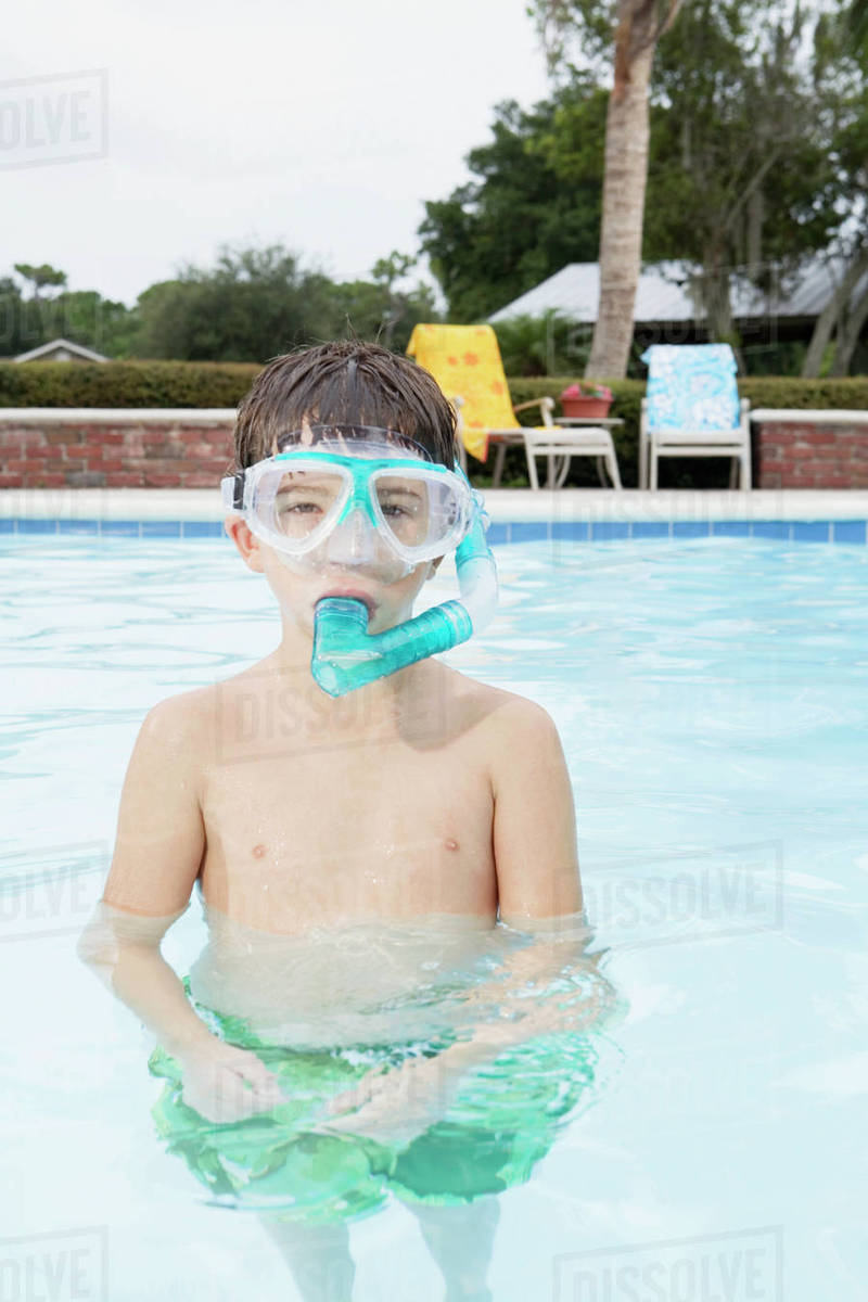 Boy snorkeling in swimming pool Stock Photo Dissolve