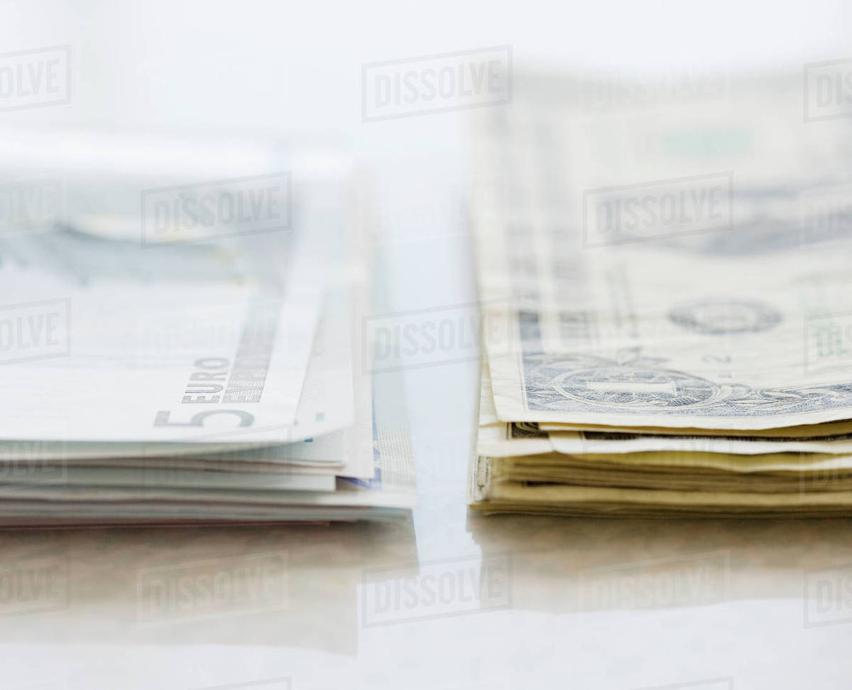 Stacks Of Euros And American Dollars Stock Photo Dissolve Stacks Of Euros And American Dollars