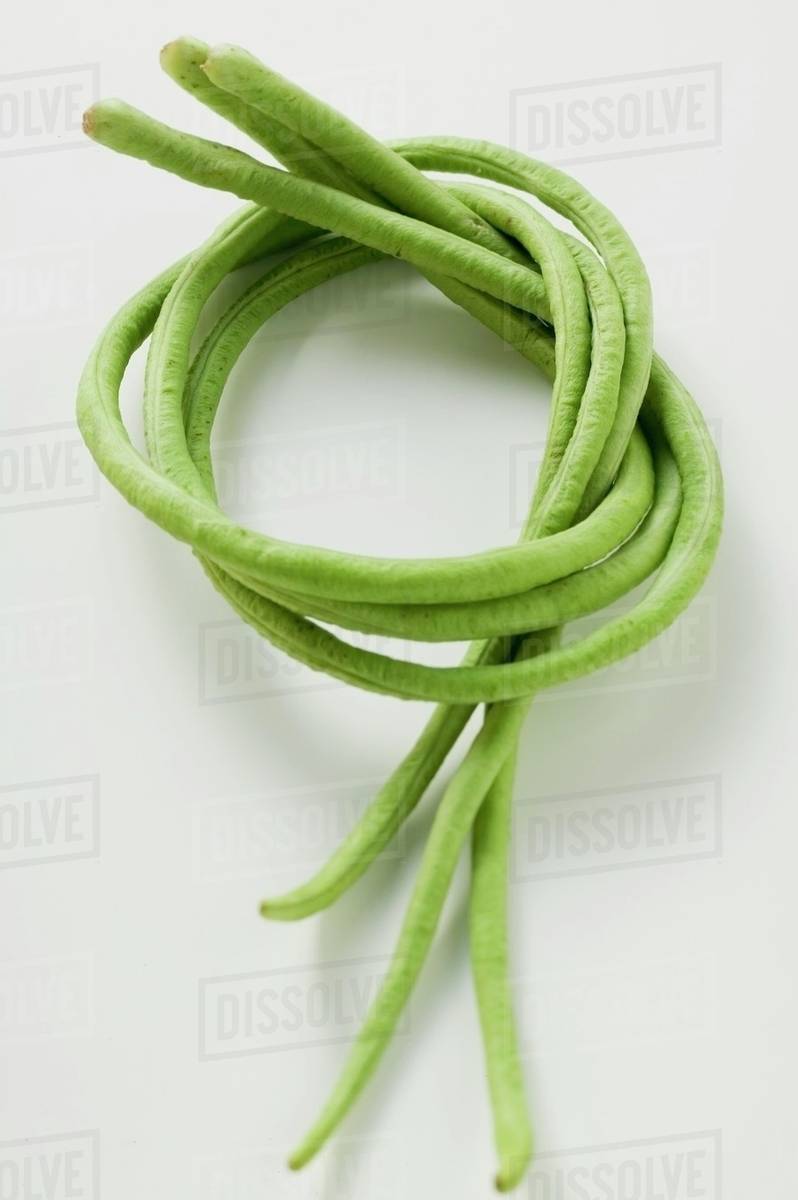 Three asparagus beans Stock Photo Dissolve