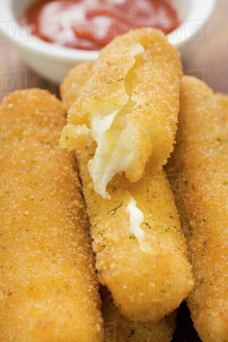 Mozzarella sticks with marinara sauce Stock Photo Dissolve