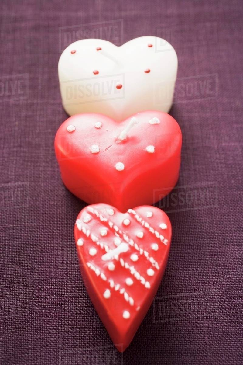 three heart shaped candles