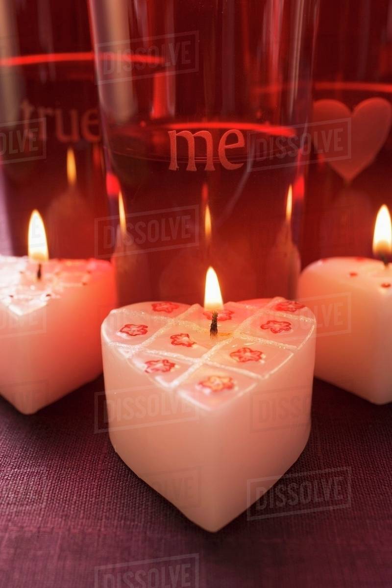 burning heart shaped candles