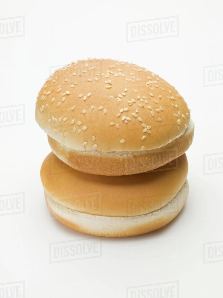 Two hamburger buns (with and without sesame seeds) Stock Photo Dissolve