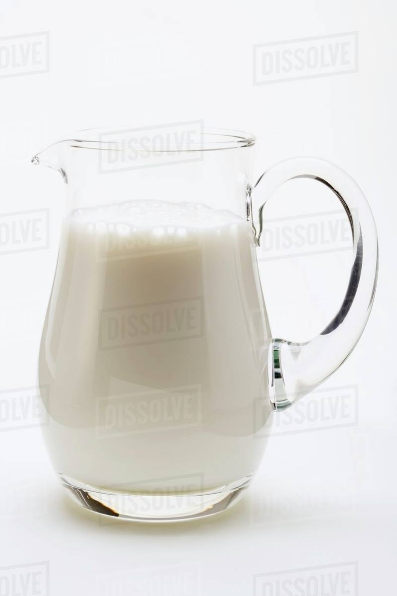 Milk in glass jug Stock Photo Dissolve