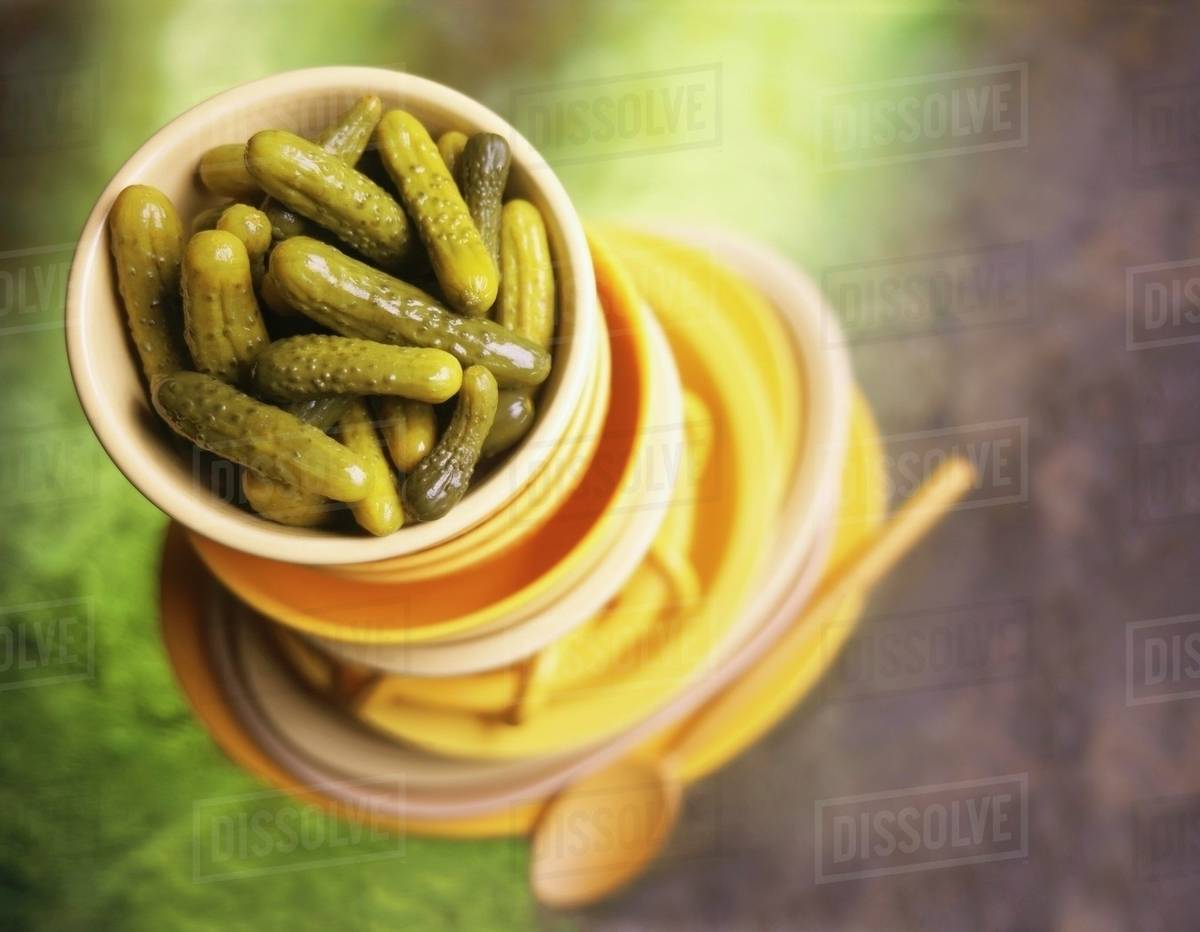 Gherkin Pickles in Stacked Bowls Stock Photo Dissolve