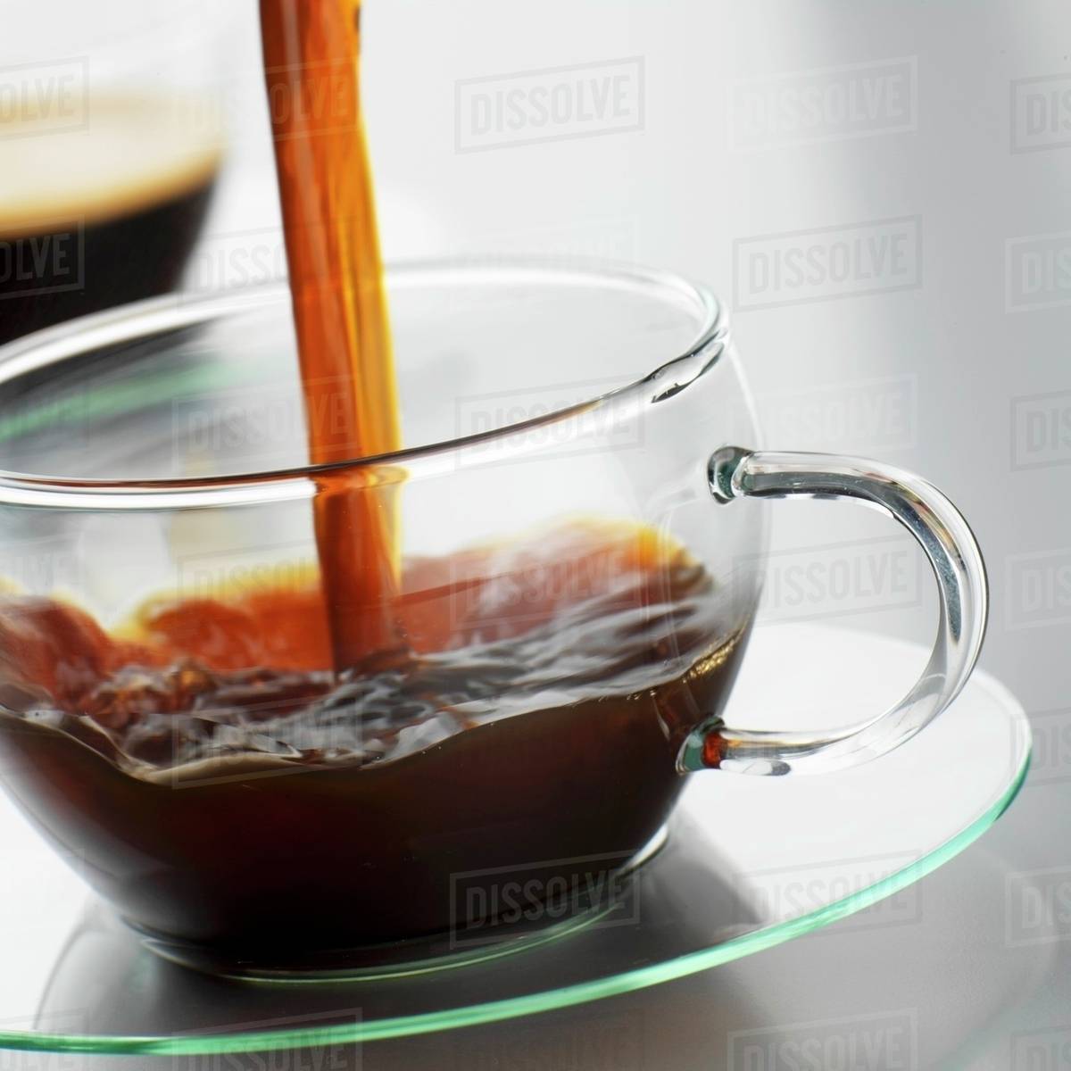 Pouring Coffee Into A Glass Cup Pouring Coffee Into A Glass Cup