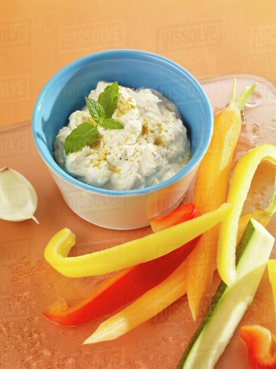 Pineapple curry dip with raw vegetables Stock Photo Dissolve