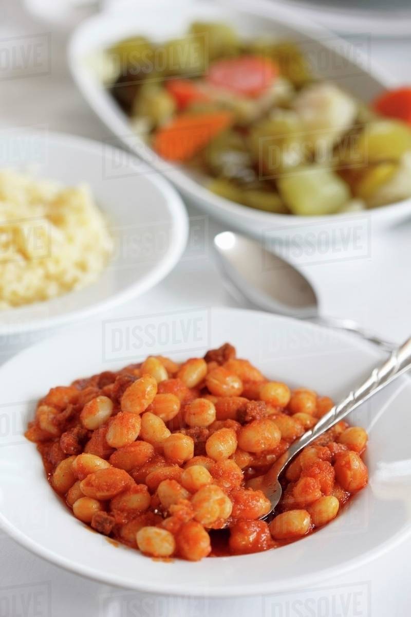 Dried beans in tomato sauce with rice and pickles (Turkey) Stock