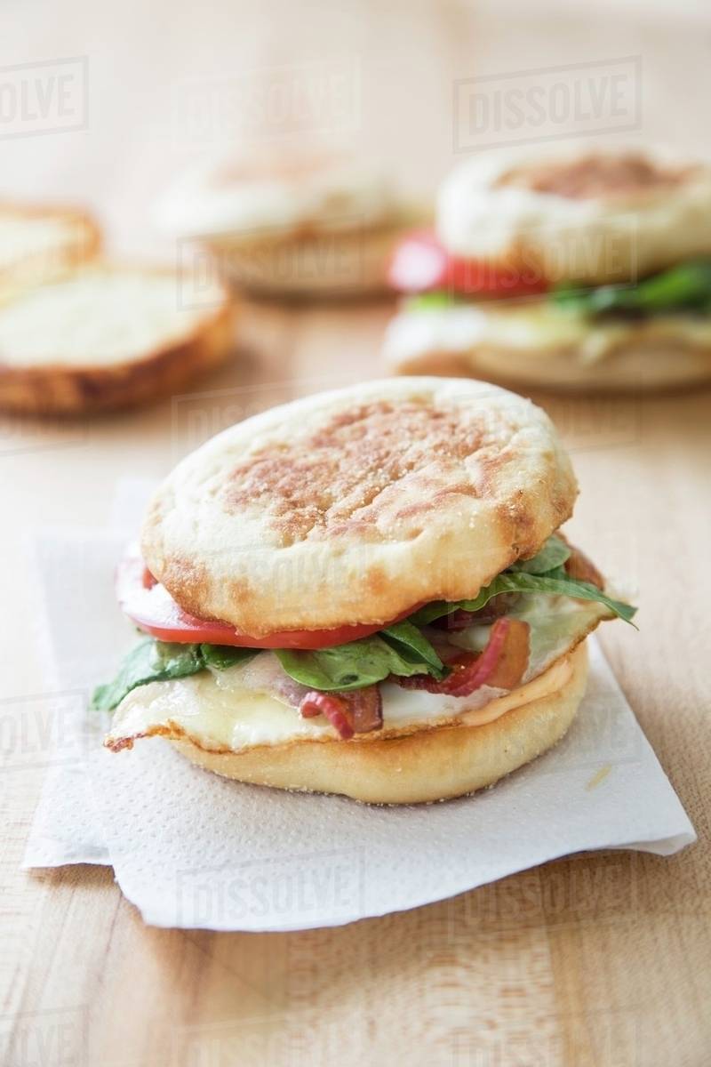 English muffins with bacon, eggs and cheese for breakfast Stock Photo