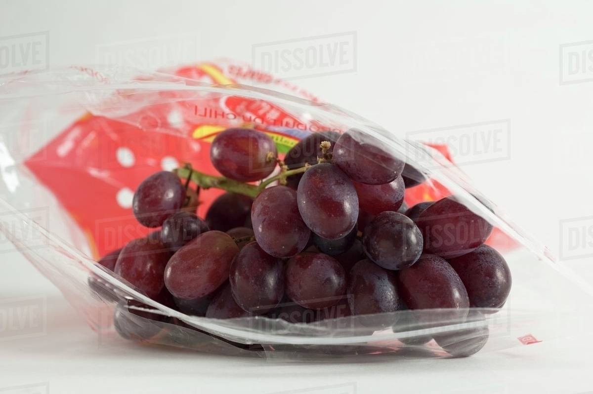 Red grapes in a Ziploc bag Stock Photo Dissolve