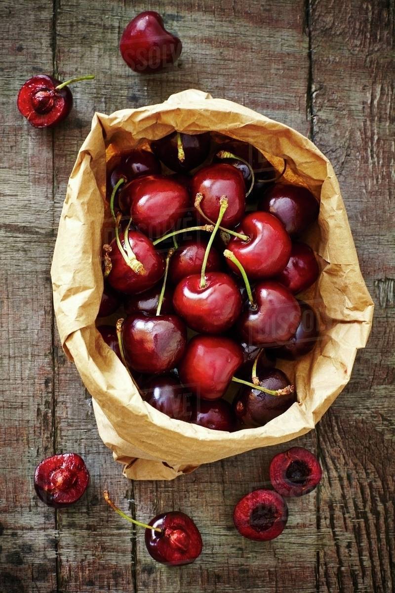 fresh spanish cherries in a brown paper bag on a d1062_52_662 fresh in spanish