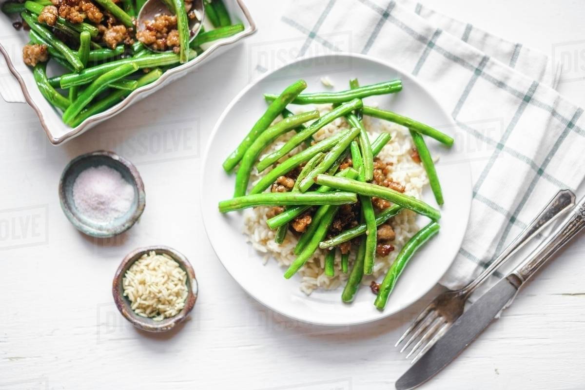 Beef with rice and green beans Stock Photo Dissolve