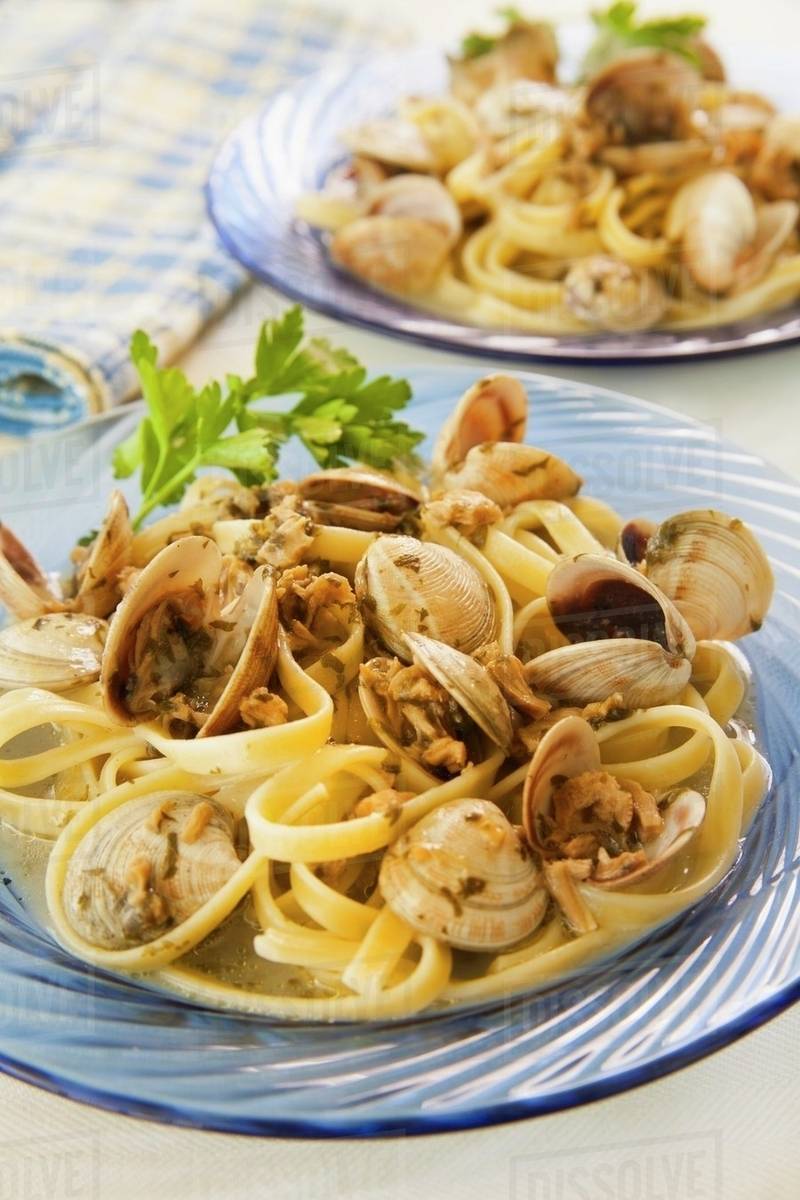 Fettuccine with Baby Clams in a White Sauce Stock Photo Dissolve