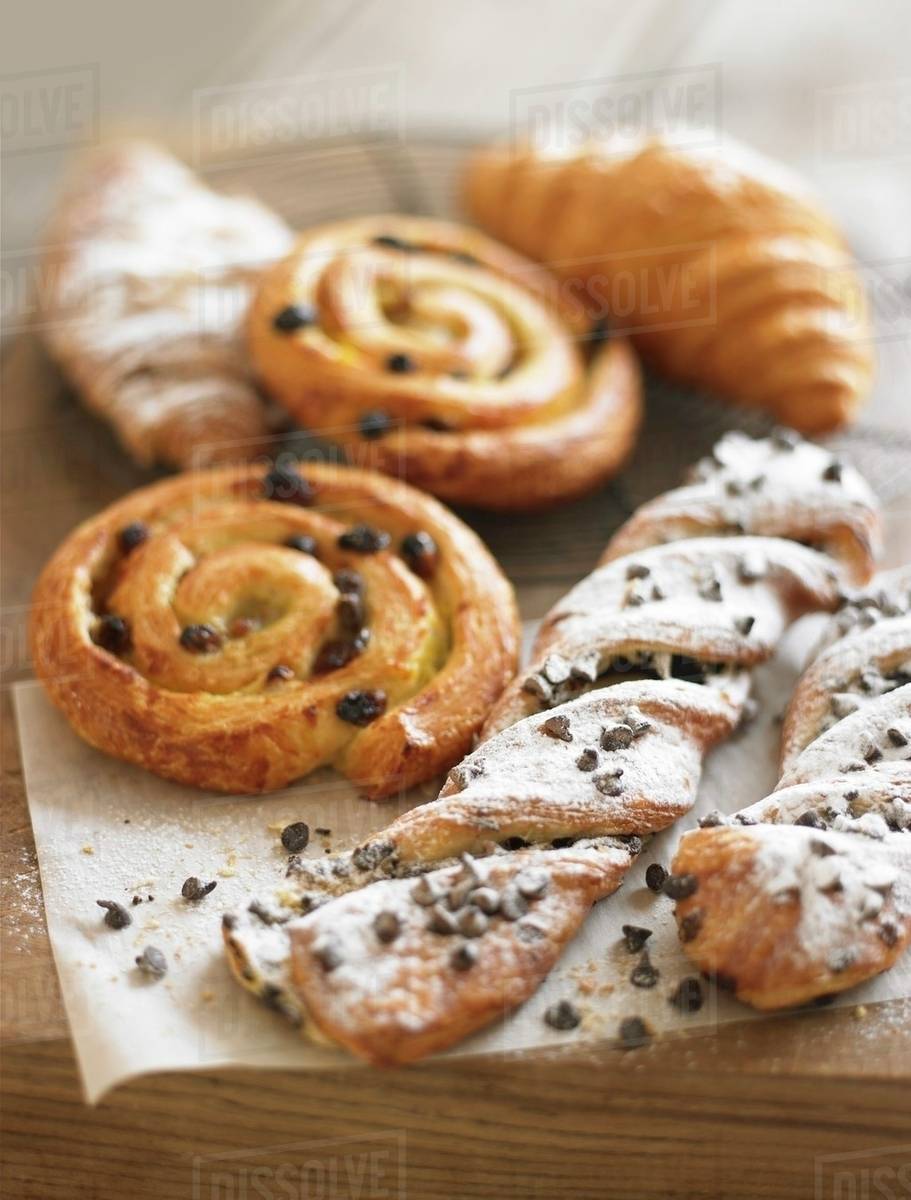 Raisin whirls, croissants and chocolate-chip puff pastry twists Royalty-free stock photo