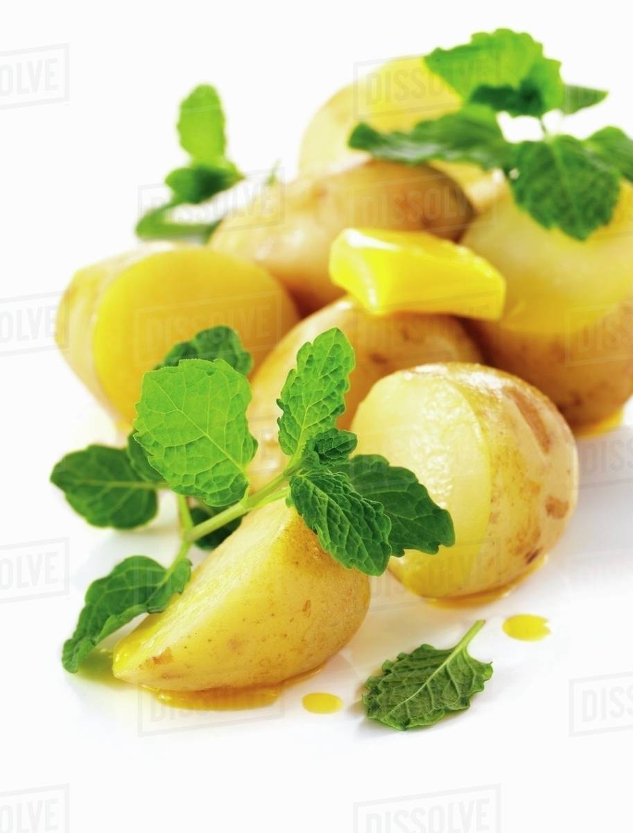 Boiled potatoes with butter and mint Stock Photo Dissolve