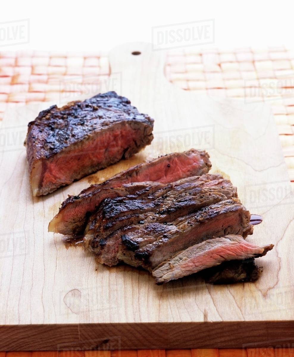 Sirloin steak, sliced Stock Photo Dissolve