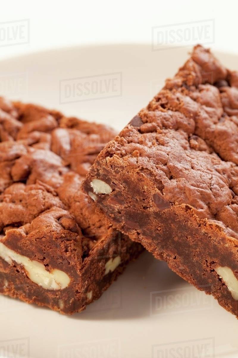 Two Vegan Nut Brownies Made with Tofu; Close Up Stock Photo Dissolve