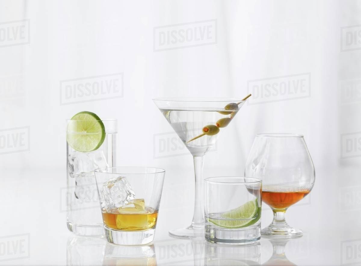 Five Assorted Glasses with Assorted Liquors Stock Photo Dissolve