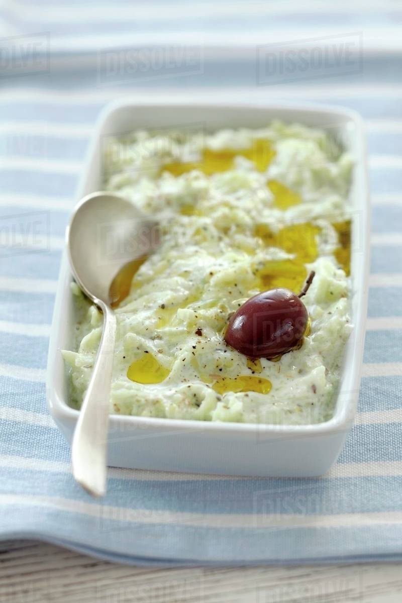 Tzatziki (cucumber yoghurt with olive oil, Greece) Stock Photo Dissolve