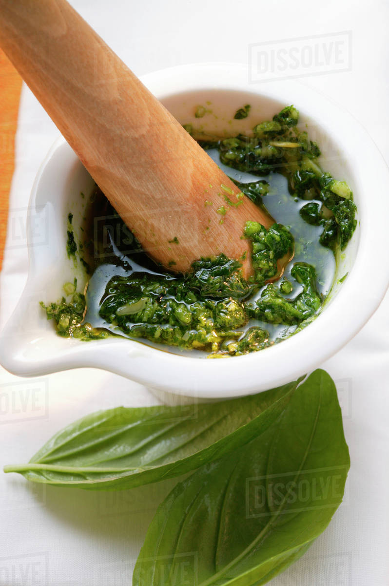Pesto in a Mortar Stock Photo Dissolve