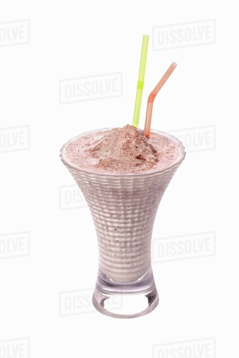 An ice cream shake with straws Stock Photo Dissolve