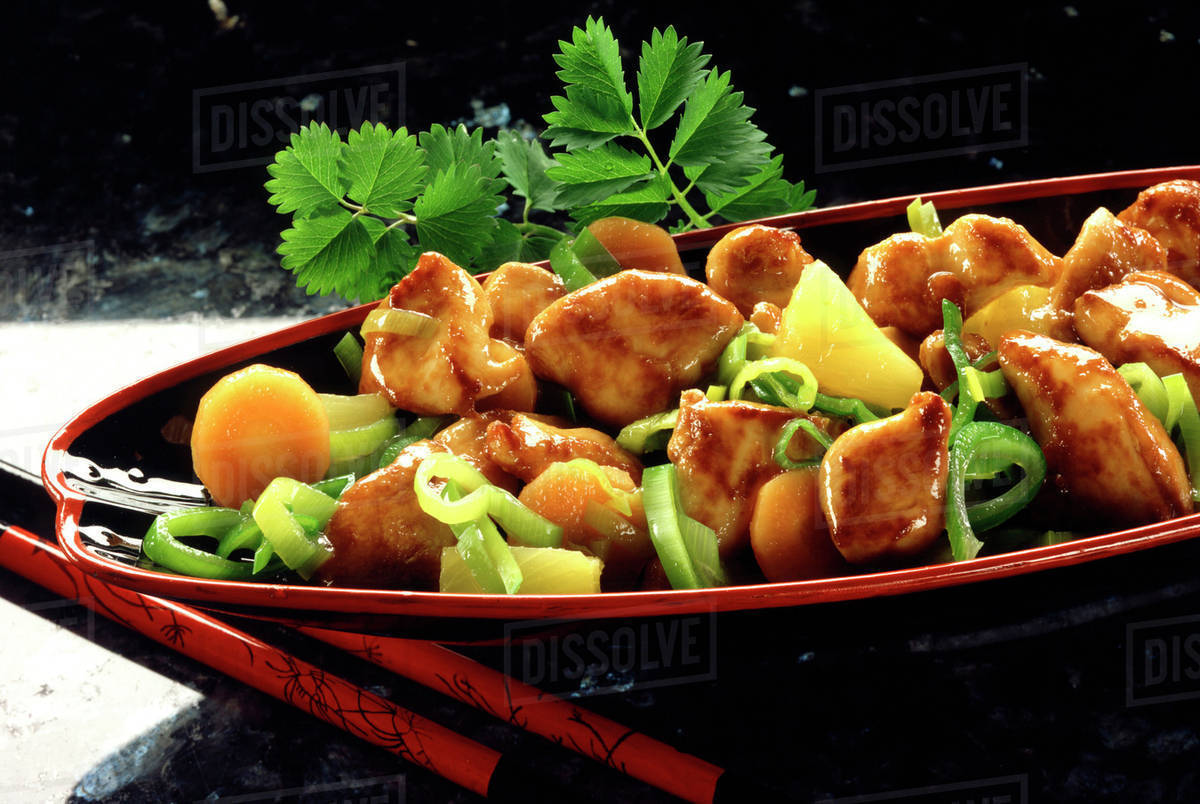Pancooked chicken dish with pineapple and vegetables (Asia) Stock Photo Dissolve
