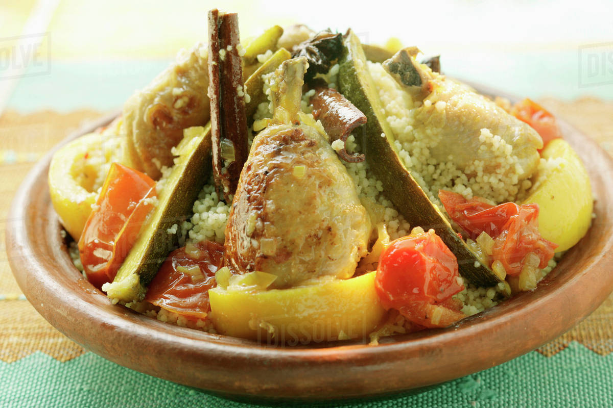 Couscous with chicken, courgettes, tomatoes, lemons & cinnamon Stock
