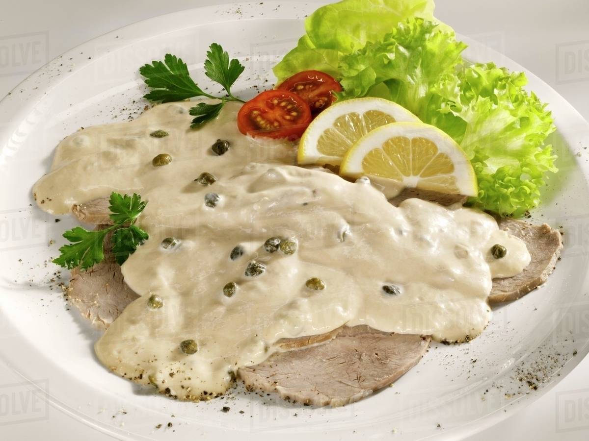 Vitello tonnato (Veal with tuna and caper sauce) Stock Photo Dissolve