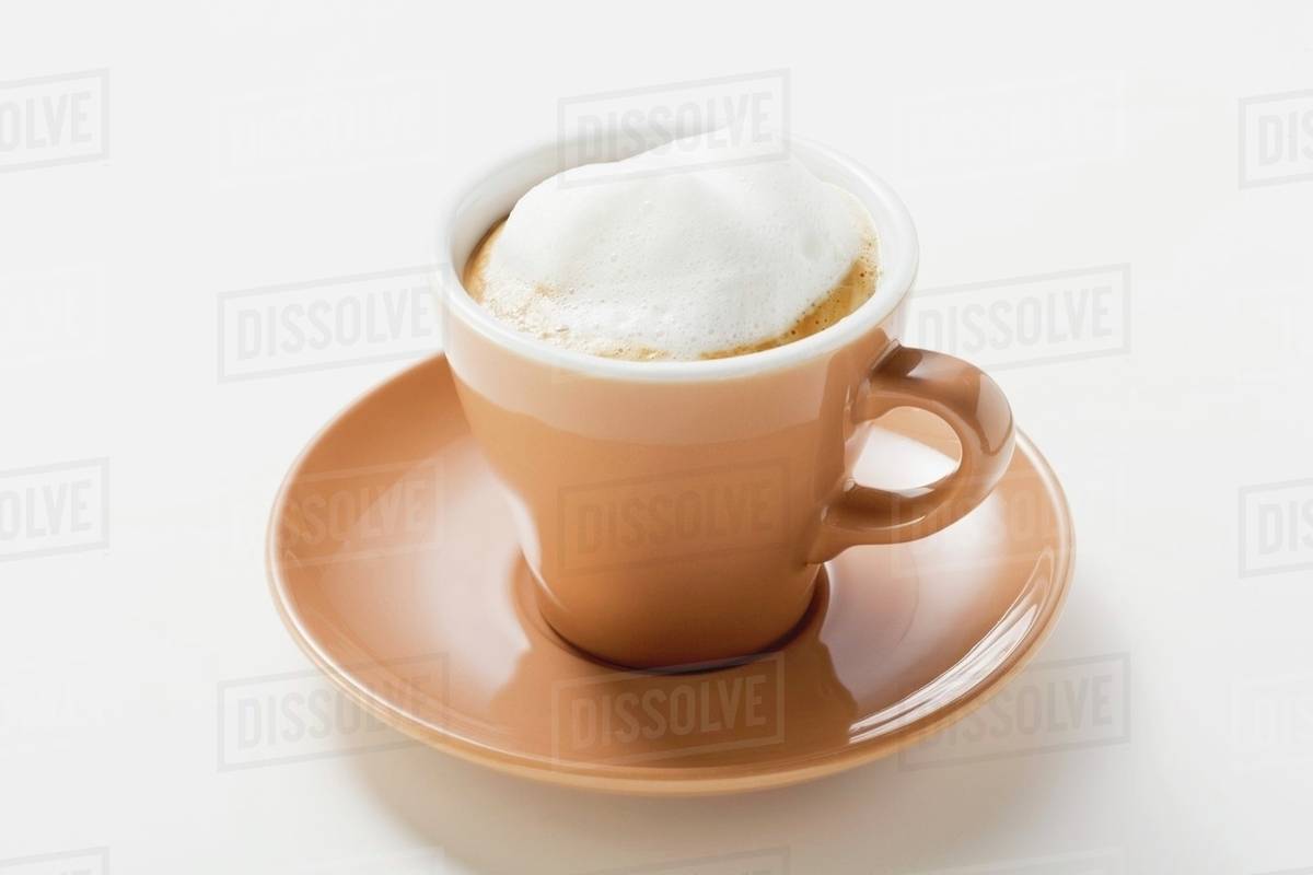 Cup of espresso with milk froth Stock Photo Dissolve