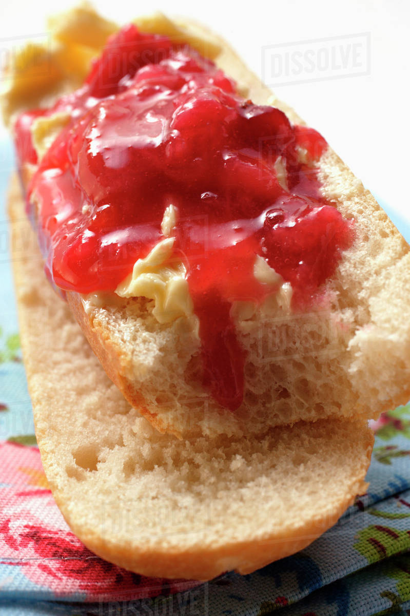 Baguette with butter and jam Stock Photo Dissolve