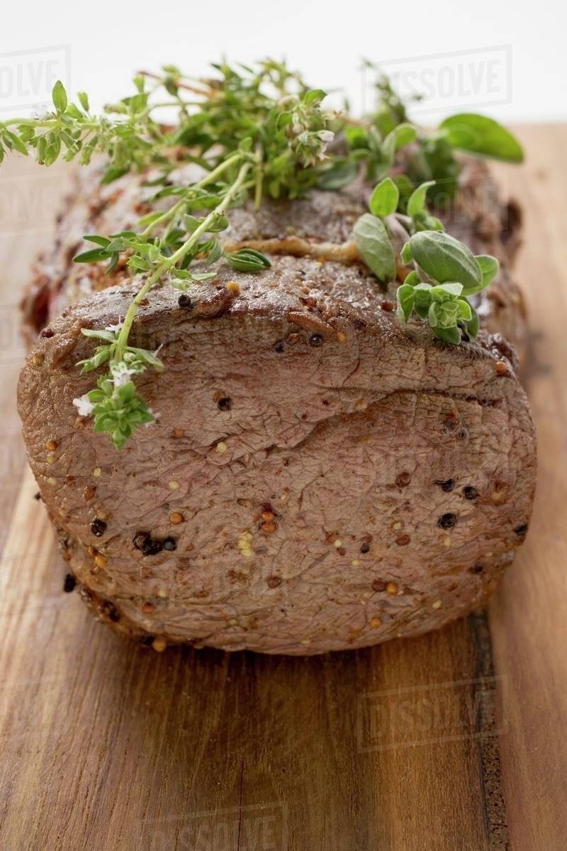 Roast beef with herbs Stock Photo Dissolve