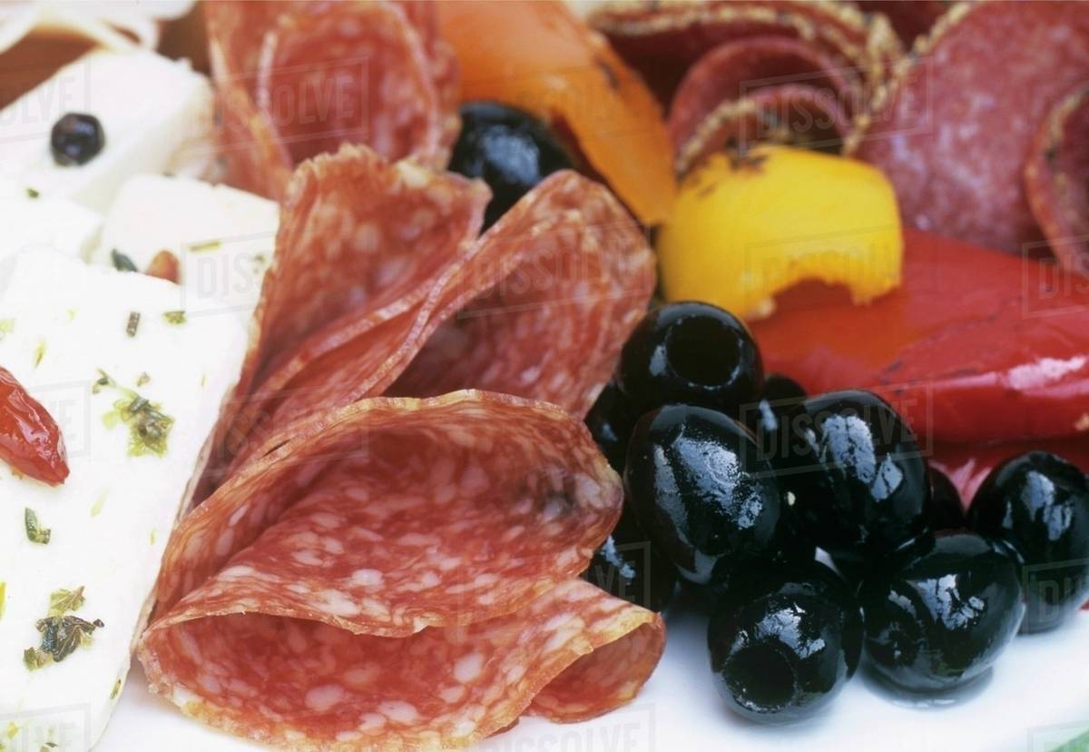 Antipasti (Salami, cheese, olive and peppers) Stock Photo Dissolve