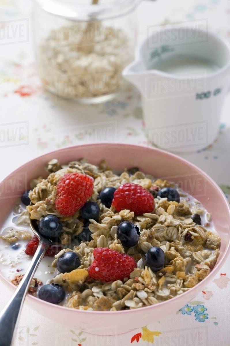 Muesli with berries and milk Stock Photo Dissolve